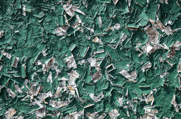 Peeling green shed wall texture abstract.