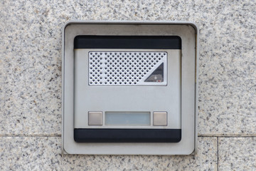 intercom on a granite wall