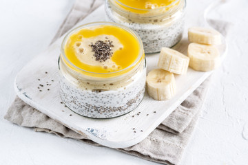 Fototapeta premium Chia seed pudding in glass jar. Superfoods concept with copy space. Healthy vegan food