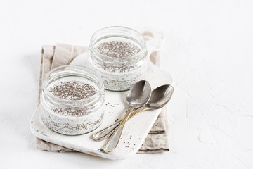Chia seed pudding in glass jar. Superfoods concept with copy space. Healthy vegan food