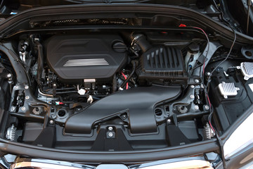 Automotive industrial part of modern new car engine room machine show all parts and open hood.