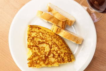Spanish tortilla with wine, tapas in Madrid bar