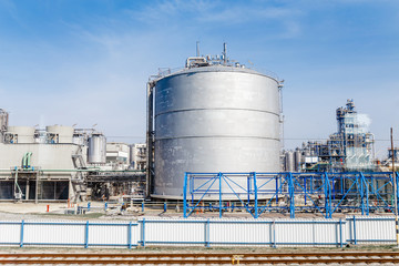 Obraz premium petrol industrial zone with big white tank