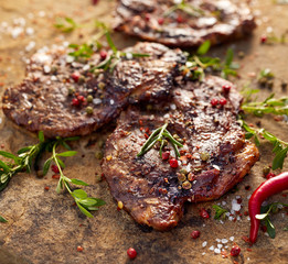 Grilled pork neck steak sprinkled with herbs and spices