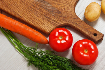 Tomato, sauce, dill on a wooden board on a rustic table. Country style. Cold appetizer. Easy snack. Healthy food. Vegetarian. Vegetables, seasonings, spices
