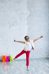 Happy afro girl with shopping bags