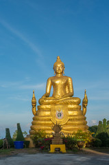 Golden buddah under blue sky