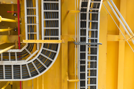 Cable tray with electrical wiring arrange on ceiling at offshore platform  Photos | Adobe Stock