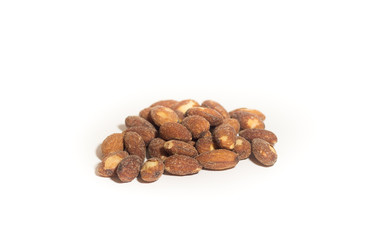Salted and roasted almonds on white background