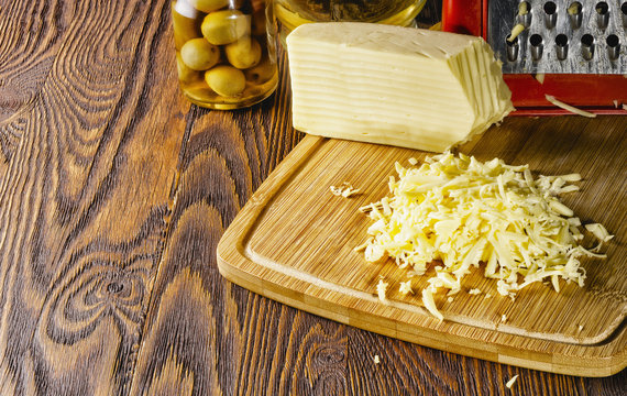 Grated strips of fresh cheese on the table