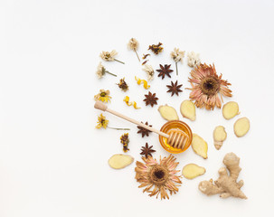 Honey with  ginger over white background. Flat lay, top view, copy space