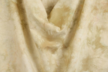 Draped tie dyed fabric.