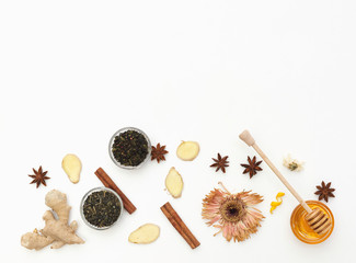 Tea with ginger and honey over white background. Flat lay composition