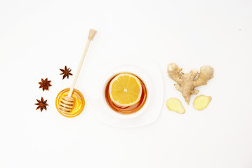 Fresh Lemon Tea with Ginger on white Background. Natural Cold Remedy. Flat lay, top view, copy space