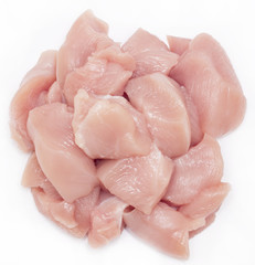 Top view of raw chicken fillet chunks isolated on white