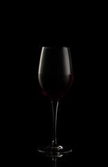 Fototapeta na wymiar Red wine glass isolated on black background