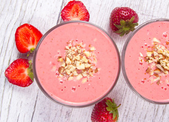 Strawberry smoothie with fresh fruit .