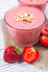 Strawberry smoothie with fresh fruit .