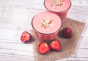 Strawberry smoothie with fresh fruit .