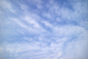 White fluffy clouds on soft color blue sky, a good weather day in Bangkok, Thailand 