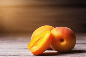Close up of ripe apricots over  wooden background