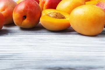 Apricots on light wooden background