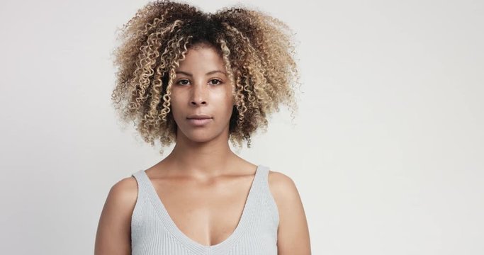 black woman with curly afro hiar portrait