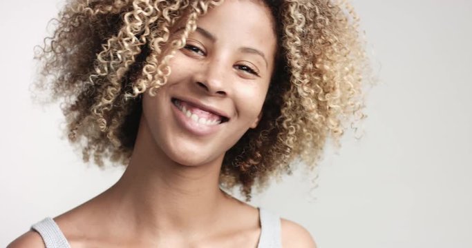 black woman with curly afro hiar portrait