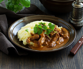 Meat sauce goulash with mashed potatoes.