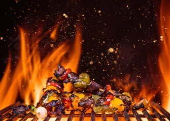  Chicken skewers on the grill with flames © Lukas Gojda