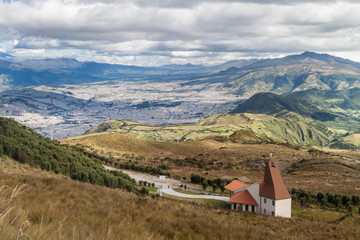 Fototapeta na wymiar Iglesia La Dolorosa church, Cruz Loma, Quito (capital of Ecuador) in the background