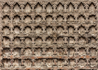 Wooden door of Sant'Anastasia Church in Verona, Italy.