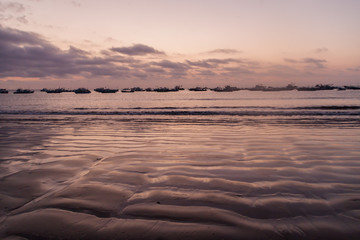 Fishing boats and a beach in Puerto Lopez, Ecuador