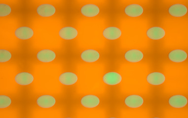 Orange background with pale green spots