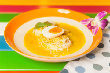 Thai vermicelli eaten with curry and boiled egg