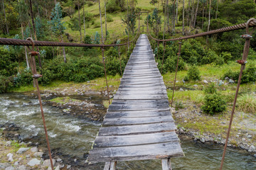 Suspension bridge over Toachi river near Quilotoa crater, Ecuador - obrazy, fototapety, plakaty