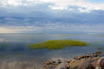 Evening sunset idyllic over the Bay. Landscape of the marine. The nature of the sea in calm.