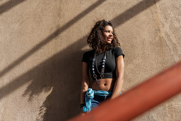 Naklejka premium Fashionable girl posing on stairs
