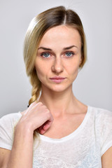 Portrait serious girl on a white background