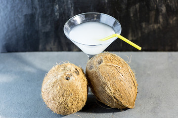 Coconut cocktail on background