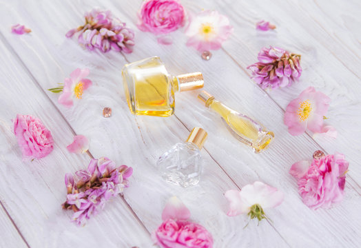 Bottles of perfume with flowers