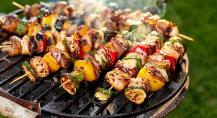 Foto auf Acrylglas Grill / Barbecue Grilled skewers on a grilled plate, outdoor