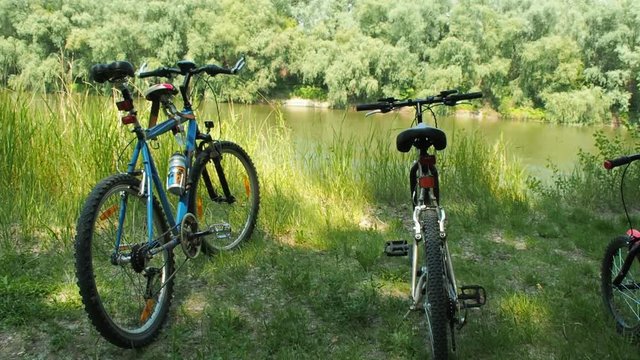 Family bicycles by the river. Bicycles on vacation.