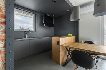 Gray kitchen with table