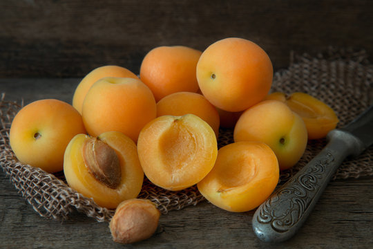Delicious ripe apricots on wooden table closeup. concept fruits