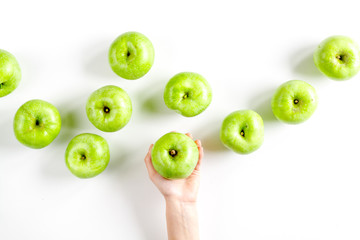 Organic fruits with green apples design on white background top view