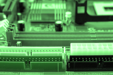 Close-up of electronic circuit board with processor toned.