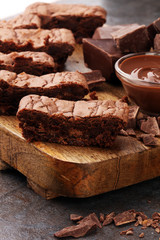 Brownie stack, chocolate cake on rustic wooden board