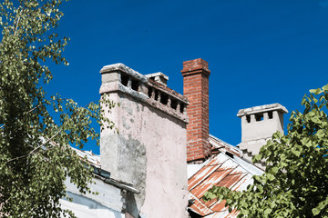 Brick pipes on the roof of the old building.