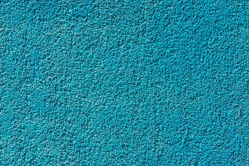 Obraz premium Blue plaster on the facade of a modern building background texture.